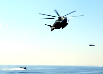 US Navy 091012-N-3165S-092 A CH-53E Super Stallion helicopter prepares to land aboard the multi-purpose amphibious assault ship USS Bataan (LHD 5) photo