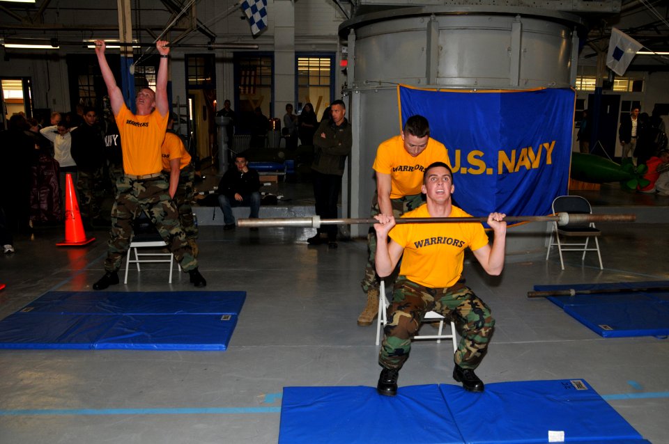 US Navy 091010-N-8848T-888 Marquette University Naval ROTC midshipmen do squats with a weight lifting bar during the urban adventure run
