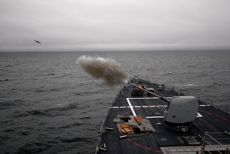 US Navy 091013-N-1688B-011 A 5-inch-54-caliber (Mk 45) lightweight gun is fired aboard the guided-missile destroyer USS Cole (DDG 67) during a live fire exercise