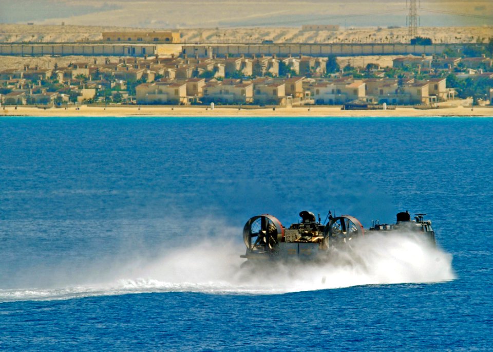 US Navy 091012-N-5345W-217 A landing craft, air cushion assigned to Assault Craft Unit (ACU) 4 approaches the amphibious assault ship USS Bataan (LHD 5) during a Bright Star 2009 exercise