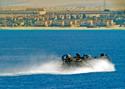 US Navy 091012-N-5345W-217 A landing craft, air cushion assigned to Assault Craft Unit (ACU) 4 approaches the amphibious assault ship USS Bataan (LHD 5) during a Bright Star 2009 exercise