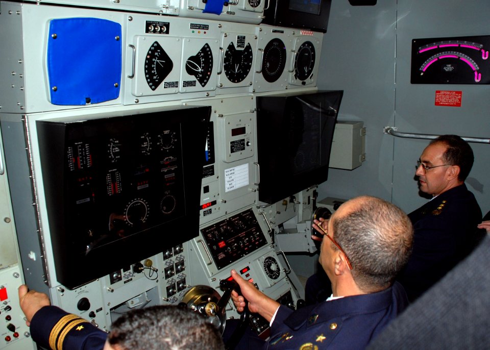 US Navy 091013-N-3090M-412 Algerian Navy Submarine Force Commander Col. Nacer Bousseboua, right, and Algerian Submarine Base Commander Lt. Col. Ahmed Delsi operate the Los Angeles-class submarine trainer