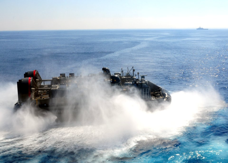 US Navy 091012-N-3165S-114 A landing craft, air cushion (LCAC) from Assault Craft Unit (ACU) 4 turns after exiting the well deck of the multi-purpose amphibious assault ship USS Bataan (LHD 5)