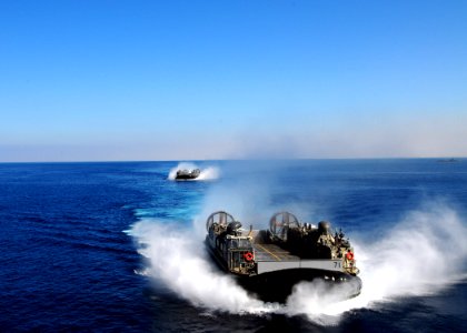 US Navy 091011-N-3165S-077 A landing craft, air cushion (LCAC) assigned to Assault Craft Unit (ACU) 4 prepares to enter the well deck of the multi-purpose amphibious assault ship USS Bataan (LHD 5) photo
