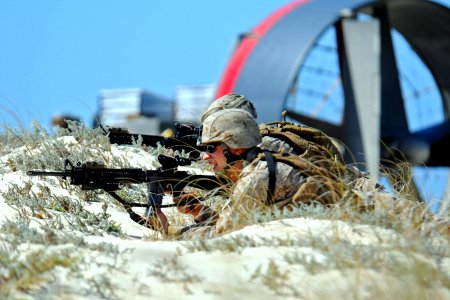 US Navy 091012-N-1512O-173 Marines assigned to the 22nd Marine Expeditionary Unit (22 MEU) take tactical positions during an amphibious beach assault demonstration for Exercise Bright Star 2009