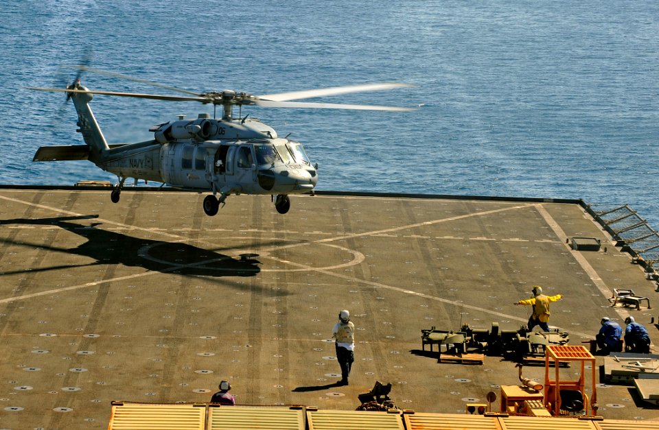US Navy 091012-N-5345W-255 An MH-60S Sea Hawk helicopter assigned to the Sea Knights of Helicopter Sea Combat Squadron (HSC) 22 lands aboard the amphibious dock landing ship USS Fort McHenry (LSD 43)