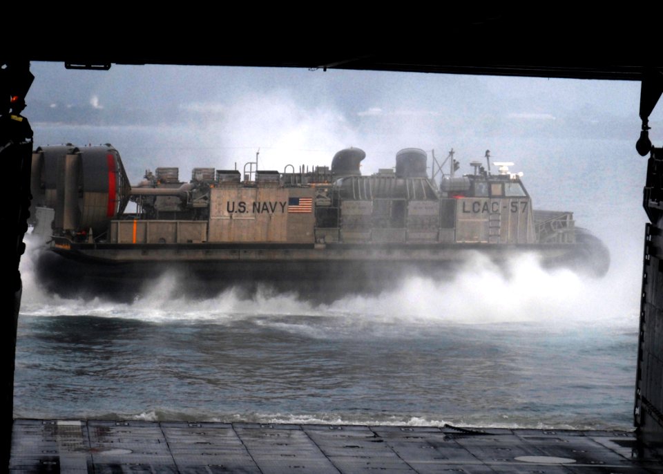 US Navy 091012-N-6692A-115 A landing craft air cushion vehicle from Assault Craft Unit (ACU) 5 departs the well deck of the amphibious dock landing ship USS Tortuga (LSD 46)