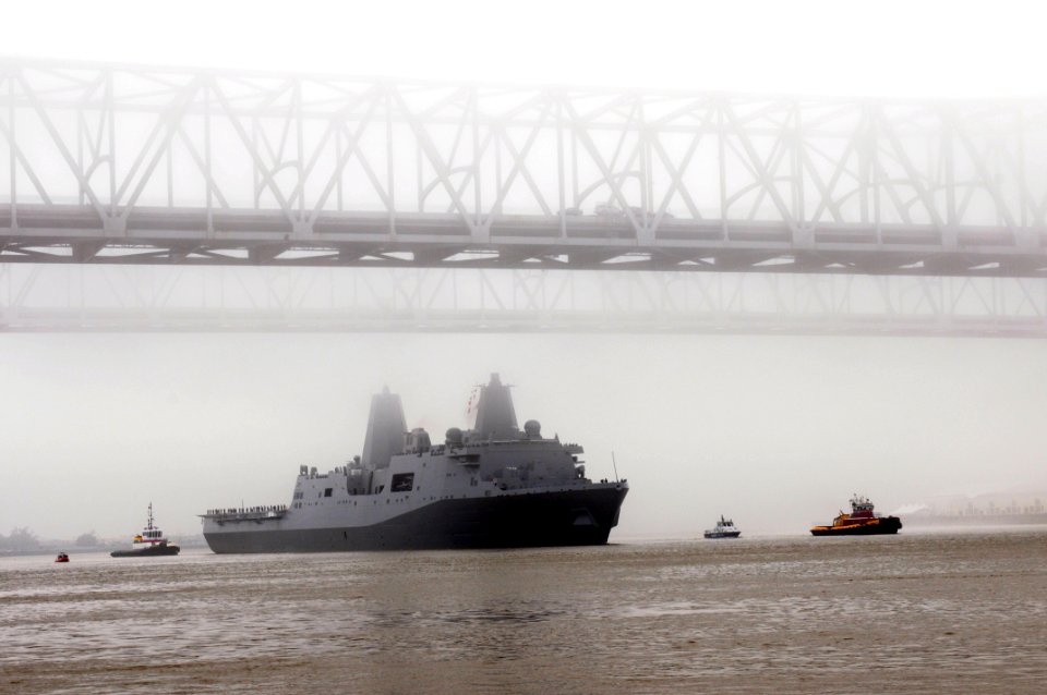 US Navy 091013-N-9712C-002 The amphibious transport dock ship Pre-Commissioning Unit (PCU) New York (LPD 21) maneuvers under the New Orleans Crescent City Connection bridge on the Mississippi River after departing Northrop Grum
