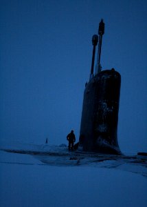 US Navy 091013-N-0932F-006 Machinist Mate 2nd Class Corey Stabenow inspects the deck of the Virginia-class fast-attack submarine USS Texas (SSN 775) after surfacing in the vicinity of the North Pole
