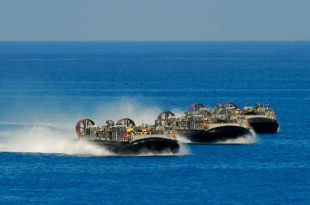 US Navy 091012-N-5345W-203 Three landing craft air cushion vehicles assigned to Assault Craft Unit (ACU) 4 approach the shore after launching from the multi-purpose amphibious assault ship USS Bataan (LHD 5