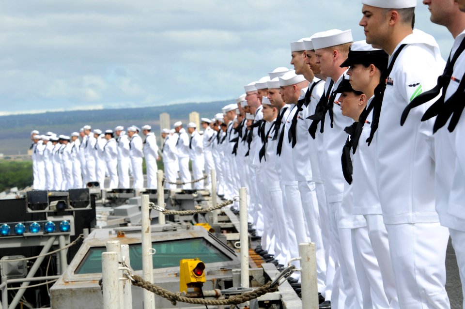 US Navy 091013-N-3659B-049 Sailors assigned to the aircraft carrier USS Ronald Reagan (CVN 76) man the rails as the ship pulls into Pearl Harbor, Hawaii