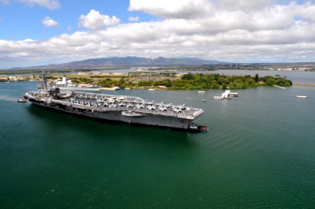 US Navy 091013-N-1635S-007 Sailors aboard the aircraft carrier USS Ronald Reagan (CVN 76) render honors to the USS Arizona Memorial as Ronald Reagan arrives for a scheduled port visit to Pearl Harbor, Hawaii photo