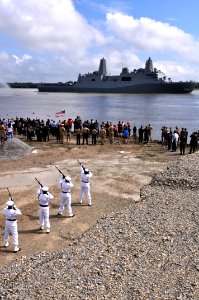 US Navy 091013-N-9712C-014 Members of the Naval Air Station Joint Reserve Base New Orleans honor guard render honors to the amphibious transport dock ship Pre-Commissioning Unit (PCU) New York (LPD 21) as the ship transits the