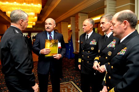 US Navy 091014-N-8273J-024 Chief of Naval Operations (CNO) Adm. Gary Roughead, left, speaks with panelist retired Vice Adm. Dennis McGinn and senior naval leadership at the 2009 Naval Energy Forum photo