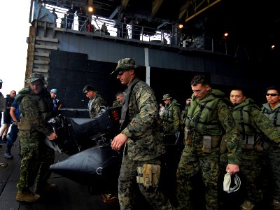 US Navy 091014-N-0807W-086 Sailors and Marines move combat rubber raiding crafts out of the well deck of the amphibious dock landing ship USS Harpers Ferry (LSD 49) during a ship-to-shore combat rubber raid craft offload exerc
