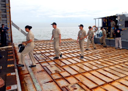 US Navy 091014-N-6692A-010 Sailors from the Philippine navy arrive aboard the amphibious dock landing ship USS Tortuga (LSD 46) for training during Amphibious Landing Exercise (PHIBLEX) 2009 photo