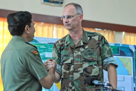 US Navy 091014-N-9950J-111 Rear Adm. Richard Landolt, commander, Amphibious Force U.S. 7th Fleet, bids farewell to Maj. Gen. Aslizar Tanjung, Indonesian National Defense Force task force coordinator