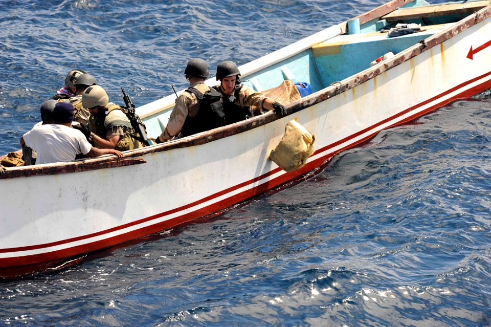 US Navy 091015-N-9500T-081 A member of a visit, board, search and seizure team from the guided-missile cruiser USS Anzio (CG 68) disposes of a bag of illegal narcotics