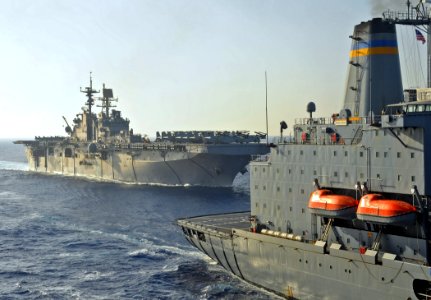 US Navy 091016-N-1831S-249 The amphibious assault ship USS Bataan (LHD 5) pulls alongside the Military Sealift Command fleet replenishment oiler USNS Kanawha (T-AO 196) to conduct a replenishment-at-sea