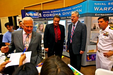 US Navy 091015-N-8863V-280 Dr. Buzz Aldrin, left, Apollo 11 astronaut, signs autographs for school children
