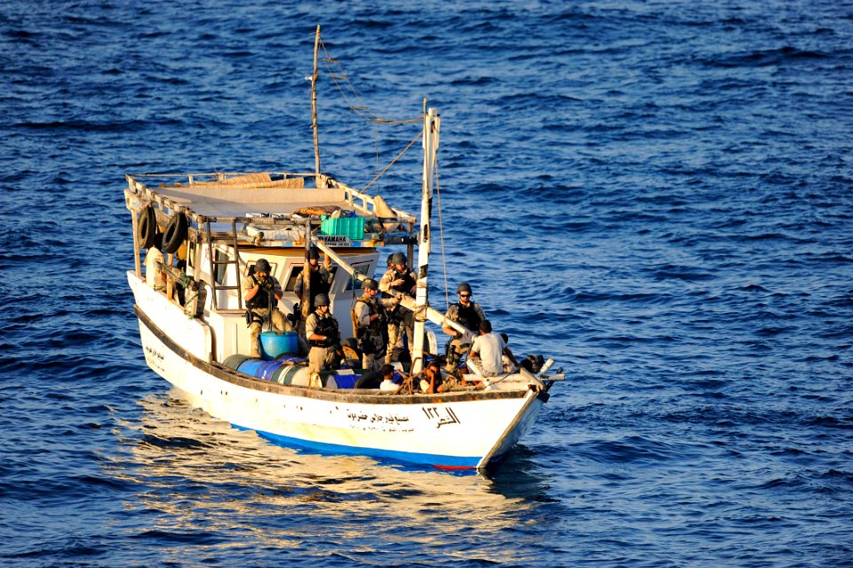 US Navy 091014-N-9500T-224 Members of the visit, board, search and seizure team from the guided-missile cruiser USS Anzio (CG 68) search a suspicious dhow during counter-piracy operations in the Gulf of Aden