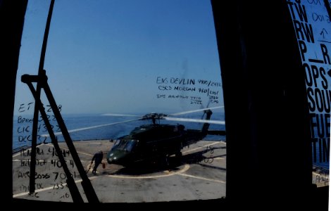 US Navy 091016-N-7478G-098 Sailors pull the chocks and chains from an SH-60F Sea Hawk helicopter during flight quarters aboard the amphibious command ship USS Blue Ridge (LCC 19)