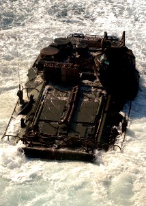 US Navy 091017-N-5148B-028 An amphibious assault vehicle assigned to the 11th Marine Expeditionary Unit (11th MEU) debarks the well deck of the dock landing ship USS Rushmore (LSD 47) photo