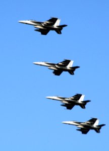 US Navy 091018-N-3038W-537 Aircraft assigned to Carrier Air Wing (CVW) 11 fly in formation over the aircraft carrier USS Nimitz (CVN 68)