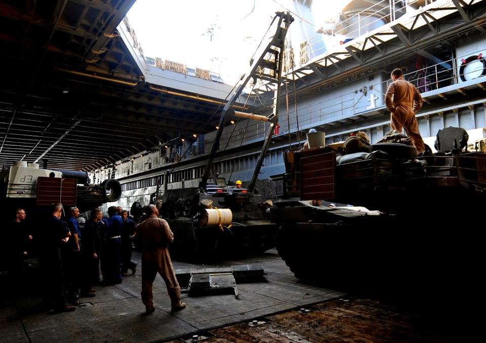 US Navy 091015-N-5345W-038 Marines assigned to the 22nd Marine Expeditionary Unit (22nd MEU) embarked aboard the amphibious dock landing ship USS Fort McHenry (LSD 43) use an M88A2 Hercules recovery vehicle to replace the engin