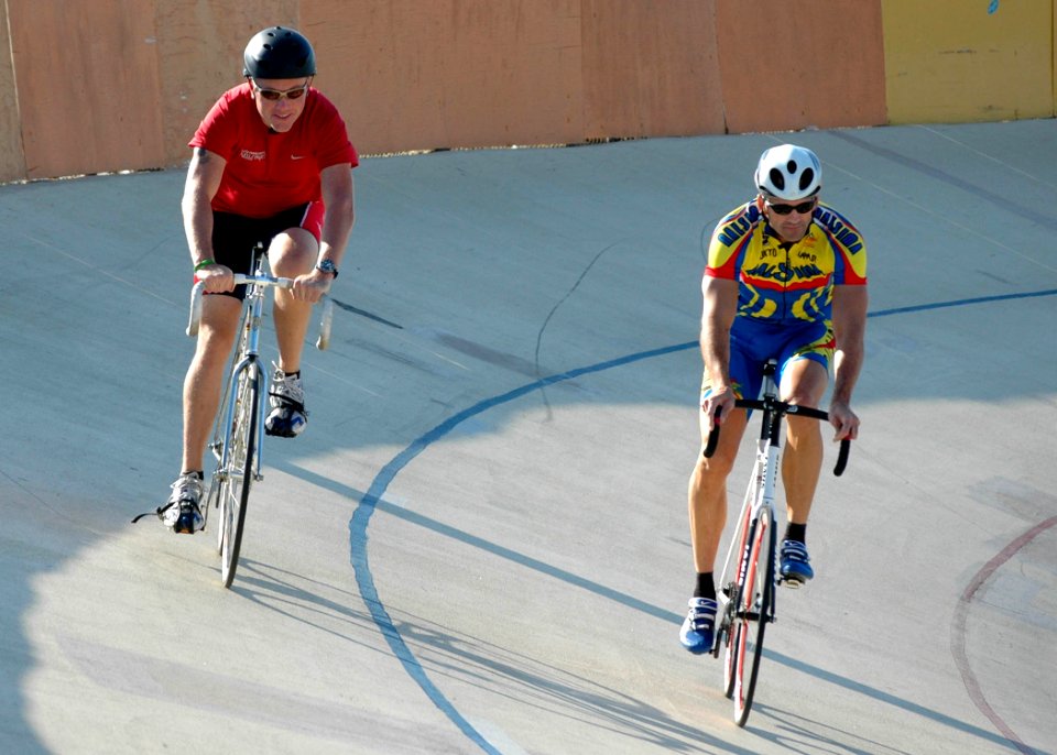US Navy 091015-N-7032B-054 Retired Army Spc. Chester Triplett, left, who is legally blind, and Reserve Marine Col. Gregg Moore, a volunteer, ride around the San Diego Velodrome track at Balboa Park, San Diego