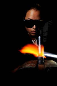 US Navy 091017-N-3038W-074 Hull Technician Fireman Gillian Jackson brazes a pipe in the welding shop aboard the aircraft carrier USS Nimitz (CVN 68) photo