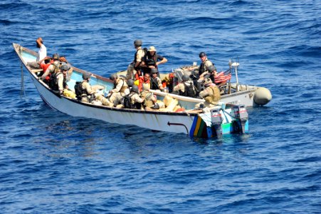US Navy 091015-N-9500T-044 Members of a visit, board, search and seizure team from the guided-missile cruiser USS Anzio (CG 68) and U.S. Coast Guard Maritime Safety and Security Team 91104 search a skiff