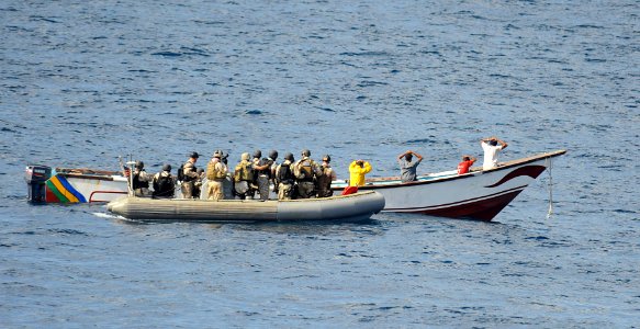 US Navy 091015-N-9500T-016 Members of a visit, board, search and seizure team from the guided-missile cruiser USS Anzio (CG 68) and U.S. Coast Guard Maritime Safety and Security Team 91104 prepare to board a skiff