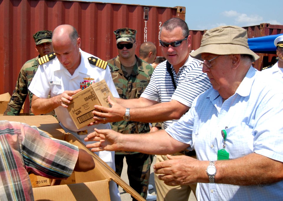 US Navy 091017-N-0515W-117 Capt. Jonathan Harden, executive officer of the amphibious assault ship USS Bonhomme Richard, helps load Project Handclasp medical supplies and hygiene products donated to the people of Timor-Leste