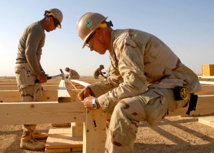 US Navy 091017-N-9564W-039 Builder 2nd Class Clayton Condon, right, and Construction Electrician 2nd Class Daniel Arteche