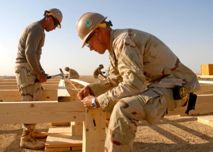 US Navy 091017-N-9564W-039 Builder 2nd Class Clayton Condon, right, and Construction Electrician 2nd Class Daniel Arteche photo