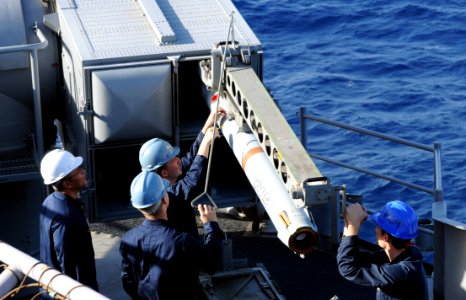 US Navy 091017-N-0890S-030 Sailors load a RIM-7M Sea Sparrow surface-to-air missile into a launcher aboard the multi-purpose amphibious assault ship USS Wasp (LHD 1)