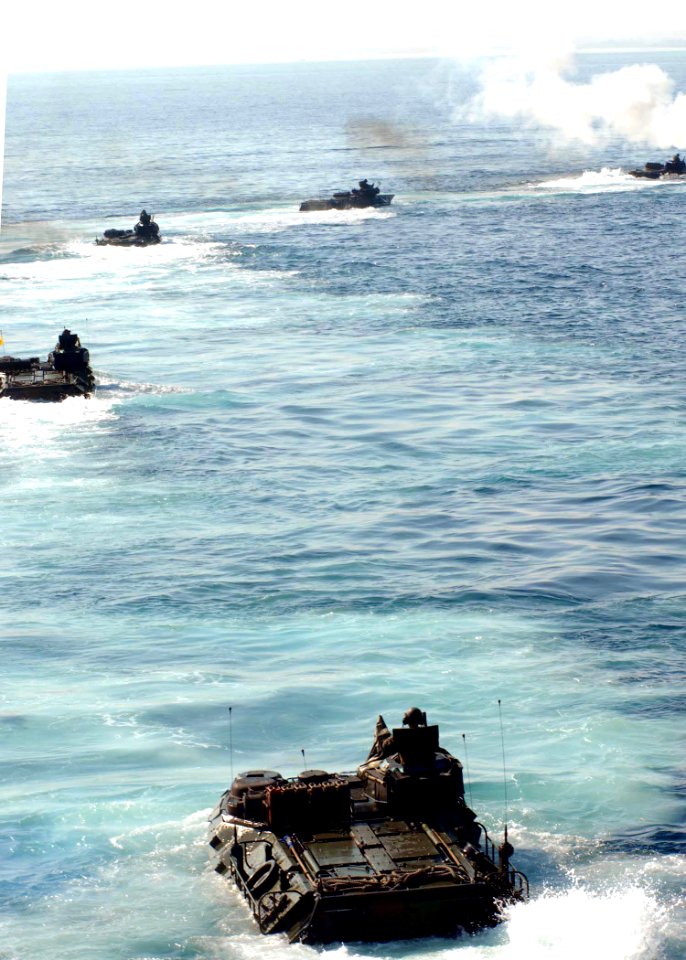US Navy 091017-N-5148B-019 Amphibious assault vehicles assigned to the 11th Marine Expeditionary Unit (11th MEU) debark the well deck of the dock landing ship USS Rushmore (LSD 47) and head for the Indonesian shore to support
