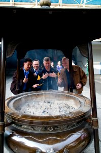 US Navy 091020-N-1251W-042 Master Chief Petty Officer of the Navy (MCPON) Rick West, center, observes an incense urn at the entrance of Sensoji Temple along with U.S. 7th Fleet Command Master Chief Marcos Sibal