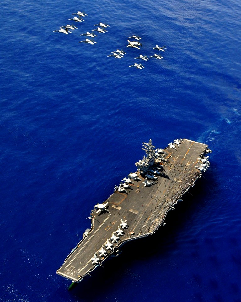 US Navy 091018-N-3610L-087 Aircraft assigned to Carrier Air Wing (CVW) 14 perform a diamond formation flyby over the aircraft carrier USS Ronald Reagan (CVN 76) during a Tiger Cruise air power demonstration