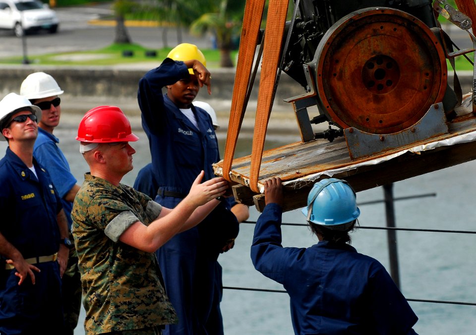 US Navy 091021-N-0807W-236 Sailors and Marines load equipment aboard the amphibious dock landing ship USS Harpers Ferry (LSD 49)