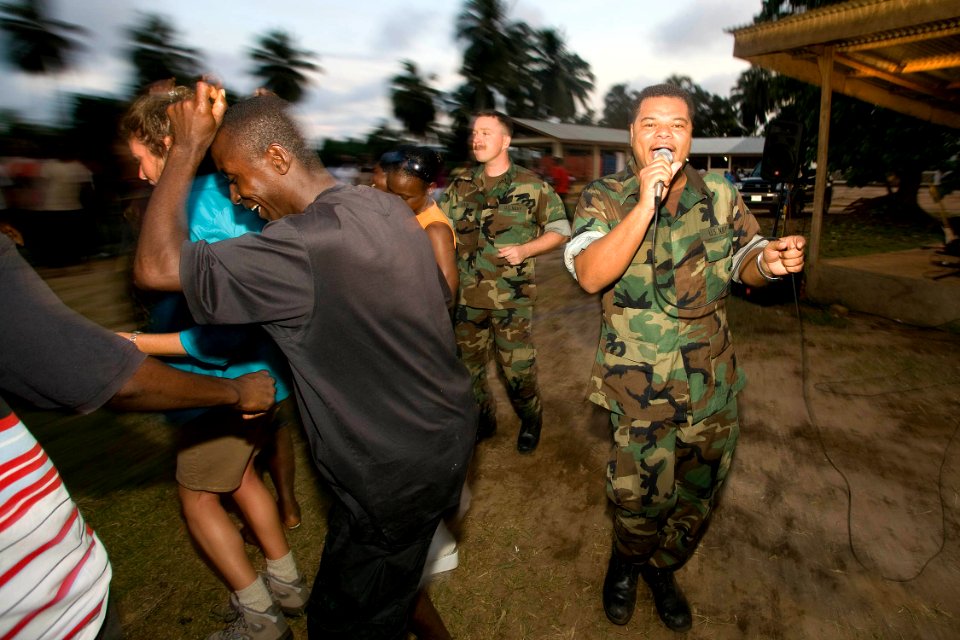 US Navy 091018-O-XXXXV-122 Musician 2nd Class Kori Gillis, a member of the Commander, U.S. Naval Forces Europe rock band, Flagship, performs for members of the Armed Forces of Liberia