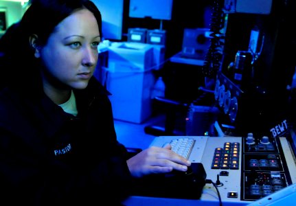US Navy 091019-N-7478G-090 Cryptologic Technician (Technical) Seaman Jennifer Pastor stands watch at the Surface Electronics Emission Console (SLQ-32) in the combat information center aboard the amphibious command ship USS Blue