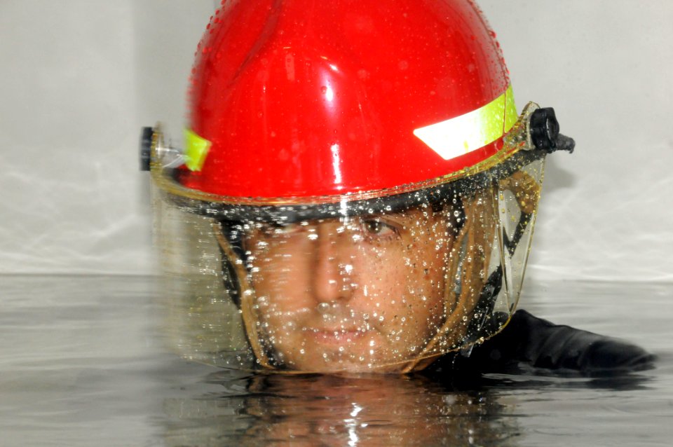 US Navy 091020-N-7498L-055 Damage Controlman 1st Class Delbert Corbin takes part in damage control training at the Center of Naval Engineering Learning Site Pearl Harbor