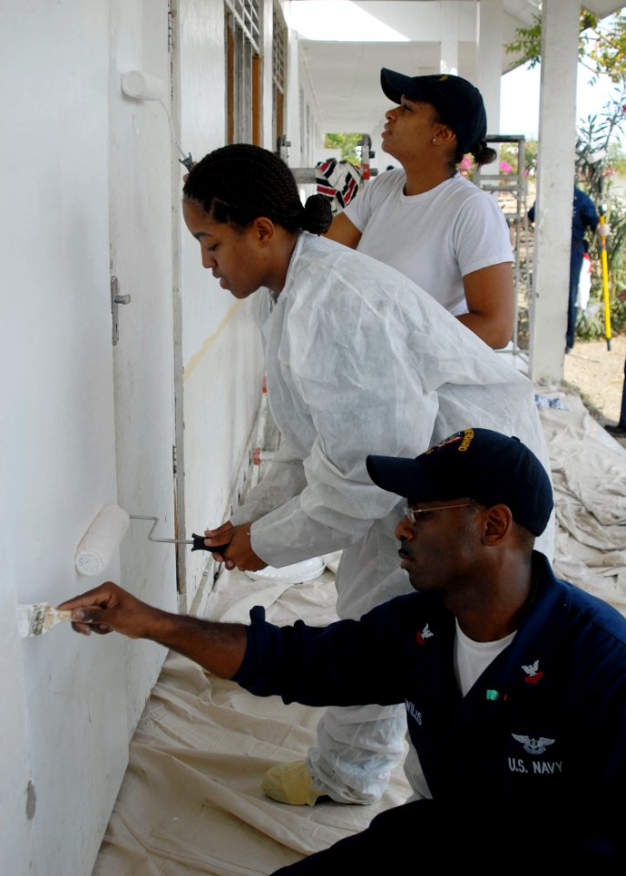 US Navy 091020-N-8607R-102 Sailors assigned to the amphibious assault ship USS Bonhomme Richard (LHD 6) paint a middle school during a community service project in Manatutu, Timor-Leste