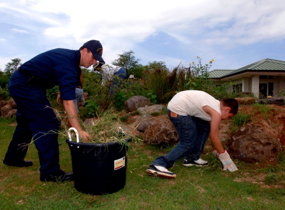 US Navy 091021-N-0535P-062 Electronics Technician 2nd Class Shiloh Stieber, assigned to Pacific Missile Range Facility, Kauai, Hawaii, pulls weeds on the biomes with volunteers and students from Ke Kula Ni`ihau O Kekaha school