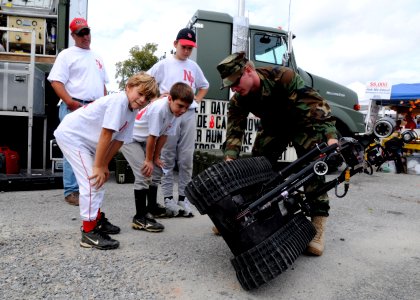 US Navy 091024-N-4267W-034 Electronics Technician 2nd Class Bruce Hammon, assigned to Explosive Ordnance Disposal Expeditionary Support Unit (EODESU) 2, demonstrates an EOD Manned Transportable Robot
