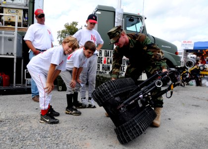 US Navy 091024-N-4267W-034 Electronics Technician 2nd Class Bruce Hammon, assigned to Explosive Ordnance Disposal Expeditionary Support Unit (EODESU) 2, demonstrates an EOD Manned Transportable Robot photo