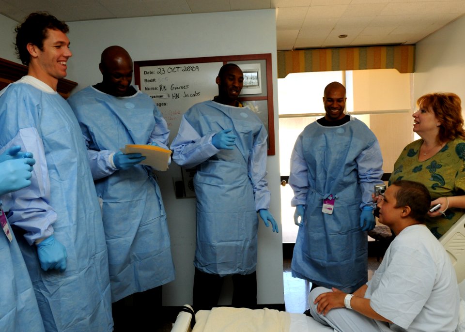 US Navy 091023-N-7214P-159 Los Angeles Lakers players Luke Walton, left, Lamar Odom, Kobe Bryant and Derek Fisher visit with Marine Sgt. Cassandra Becker and her mother at Naval Medical Center San Diego
