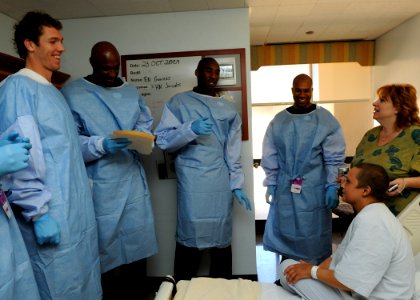 US Navy 091023-N-7214P-159 Los Angeles Lakers players Luke Walton, left, Lamar Odom, Kobe Bryant and Derek Fisher visit with Marine Sgt. Cassandra Becker and her mother at Naval Medical Center San Diego
